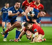 26 December 2023; Joe McCarthy of Leinster is tackled by Shane Daly of Munster during the United Rugby Championship match between Munster and Leinster at Thomond Park in Limerick. Photo by Brendan Moran/Sportsfile