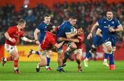 26 December 2023; Scott Penny of Leinster is tackled by Antoine Frisch and Eoghan Clarke of Munster during the United Rugby Championship match between Munster and Leinster at Thomond Park in Limerick. Photo by Brendan Moran/Sportsfile