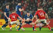 26 December 2023; Jordan Larmour of Leinster in action against Craig Casey and Jack Crowley of Munster during the United Rugby Championship match between Munster and Leinster at Thomond Park in Limerick. Photo by Brendan Moran/Sportsfile