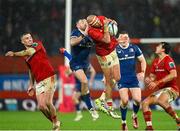 26 December 2023; Simon Zebo of Munster fields a high ball ahead of Hugo Keenan of Leinster during the United Rugby Championship match between Munster and Leinster at Thomond Park in Limerick. Photo by Brendan Moran/Sportsfile