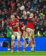26 December 2023; Hugo Keenan of Leinster and Calvin Nash of Munster contest a high ball during during the United Rugby Championship match between Munster and Leinster at Thomond Park in Limerick. Photo by Seb Daly/Sportsfile