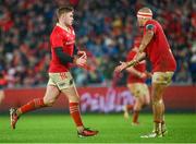 26 December 2023; Jack Crowley of Munster is congratulated by team-mate Simon Zebo after kicking a penalty during the United Rugby Championship match between Munster and Leinster at Thomond Park in Limerick. Photo by Seb Daly/Sportsfile
