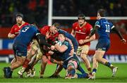 26 December 2023; Joe McCarthy of Leinster is tackled by Jack O'Donoghue of Munster during the United Rugby Championship match between Munster and Leinster at Thomond Park in Limerick. Photo by Brendan Moran/Sportsfile