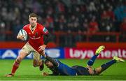 26 December 2023; Jack Crowley of Munster is tackled by Max Deegan of Leinster during the United Rugby Championship match between Munster and Leinster at Thomond Park in Limerick. Photo by Brendan Moran/Sportsfile