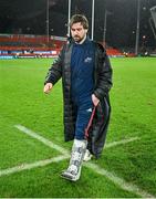 26 December 2023; Diarmuid Barron of Munster leaves the pitch in a moon boot after the United Rugby Championship match between Munster and Leinster at Thomond Park in Limerick. Photo by Brendan Moran/Sportsfile