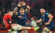 26 December 2023; Andrew Porter of Leinster attempts to charge down Munster's Paddy Patterson during the United Rugby Championship match between Munster and Leinster at Thomond Park in Limerick. Photo by Seb Daly/Sportsfile