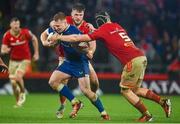 26 December 2023; Ciarán Frawley of Leinster in action against Gavin Coombes and Alex Nankivell of Munster during the United Rugby Championship match between Munster and Leinster at Thomond Park in Limerick. Photo by Seb Daly/Sportsfile