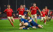 26 December 2023; Hugo Keenan of Leinster gathers a ball ahead of teammate Luke McGrath to prevent a Munster try during the United Rugby Championship match between Munster and Leinster at Thomond Park in Limerick. Photo by Brendan Moran/Sportsfile