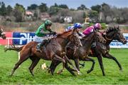 27 December 2023; Intellotto, with Daryl Jacob up, left, on their way to winning the Paddy Power I Have No Idea It Is Maiden Hurdle ahead of Mordor, with Danny Gilligan up, centre, and Lucy Wang, with Mike O'Connor up on day two of the Leopardstown Christmas Festival at Leopardstown Racecourse in Dublin. Photo by David Fitzgerald/Sportsfile