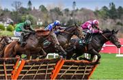 27 December 2023; Intellotto, with Daryl Jacob up, left, jumps the last on their way to winning the Paddy Power I Have No Idea It Is Maiden Hurdle ahead of Mordor, with Danny Gilligan up, centre, and Lucy Wang, with Mike O'Connor up on day two of the Leopardstown Christmas Festival at Leopardstown Racecourse in Dublin. Photo by David Fitzgerald/Sportsfile