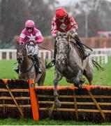 27 December 2023; Caldwell Potter, with Jack Kennedy up, right, jump the last on their way to winning the Paddy Power Future Champions Novice Hurdle ahead of Predators Gold, with Patrick Mullins up, on day two of the Leopardstown Christmas Festival at Leopardstown Racecourse in Dublin. Photo by David Fitzgerald/Sportsfile
