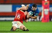 26 December 2023; Hugo Keenan of Leinster is tackled by Eoghan Clarke of Munster during the United Rugby Championship match between Munster and Leinster at Thomond Park in Limerick. Photo by Brendan Moran/Sportsfile