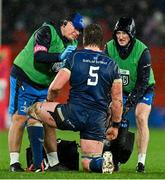 26 December 2023; Leinster head of medical Professor John Ryan, left, and head physiotherapist Garreth Farrell attend to Leinster player Joe McCarthy during the United Rugby Championship match between Munster and Leinster at Thomond Park in Limerick. Photo by Brendan Moran/Sportsfile