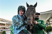 27 December 2023; Jockey Danny Mullins with Meetingofthewaters alongside groom Imran Haider after winning the Paddy Power Steeplechase on day two of the Leopardstown Christmas Festival at Leopardstown Racecourse in Dublin. Photo by David Fitzgerald/Sportsfile