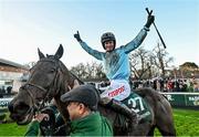 27 December 2023; Jockey Danny Mullins celebrates on Meetingofthewaters alongside groom Imran Haider after winning the Paddy Power Steeplechase on day two of the Leopardstown Christmas Festival at Leopardstown Racecourse in Dublin. Photo by David Fitzgerald/Sportsfile