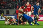 26 December 2023; Gavin Coombes of Munster is tackled by Max Deegan of Leinster during the United Rugby Championship match between Munster and Leinster at Thomond Park in Limerick. Photo by Brendan Moran/Sportsfile