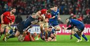 26 December 2023; Gavin Coombes of Munster is tackled by Andrew Porter of Leinster during the United Rugby Championship match between Munster and Leinster at Thomond Park in Limerick. Photo by Brendan Moran/Sportsfile