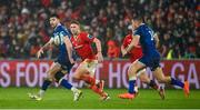 26 December 2023; Harry Byrne of Leinster, left, off-loads to teammate Jordan Larmour during the United Rugby Championship match between Munster and Leinster at Thomond Park in Limerick. Photo by Seb Daly/Sportsfile