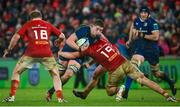 26 December 2023; Joe McCarthy of Leinster is tackled by Brian Gleeson of Munster during the United Rugby Championship match between Munster and Leinster at Thomond Park in Limerick. Photo by Seb Daly/Sportsfile