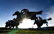 29 December 2023; Runners and riders jump a fence during the the BeattheBank.ie Irish EBF Mares Hurdle on day four of the Leopardstown Christmas Festival at Leopardstown Racecourse in Dublin. Photo by Harry Murphy/Sportsfile