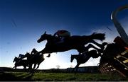 29 December 2023; Runners and riders jump a fence during the the BeattheBank.ie Irish EBF Mares Hurdle on day four of the Leopardstown Christmas Festival at Leopardstown Racecourse in Dublin. Photo by Harry Murphy/Sportsfile