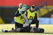 29 December 2023; Max Flynn of Ireland receives medical attention for an injury during the Challenge Match between Ireland U20 and Munster Development XV at Musgrave Park in Cork. Photo by Eóin Noonan/Sportsfile