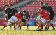 29 December 2023; Ethan Graham of Ireland is tackled by Sean Edogbo of Munster during the Challenge Match between Ireland U20 and Munster Development XV at Musgrave Park in Cork. Photo by Eóin Noonan/Sportsfile