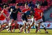 29 December 2023; Josh Stevens of Ireland is tackled by Sean Edogbo of Munster during the Challenge Match between Ireland U20 and Munster Development XV at Musgrave Park in Cork. Photo by Eóin Noonan/Sportsfile