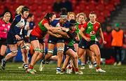 29 December 2023; Eimear Corri of Wolfhounds is tackled by Brianna Heylmann, left, and Beth Buttimer of Clovers during the Celtic Challenge match between Wolfhounds and Clovers at Musgrave Park in Cork. Photo by Eóin Noonan/Sportsfile