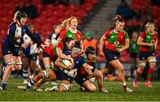 29 December 2023; Eimear Corri of Wolfhounds is tackled by Brianna Heylmann, left, and Beth Buttimer of Clovers during the Celtic Challenge match between Wolfhounds and Clovers at Musgrave Park in Cork. Photo by Eóin Noonan/Sportsfile