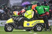 1 January 2024; Oli Jager of Munster is escorted off the pitch in a medical cart during the United Rugby Championship match between Connacht and Munster at The Sportsground in Galway. Photo by Piaras Ó Mídheach/Sportsfile