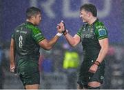 1 January 2024; Connacht players Jarrad Butler, left, and Cian Prendergast celebrate their side's victory in the United Rugby Championship match between Connacht and Munster at The Sportsground in Galway. Photo by Seb Daly/Sportsfile