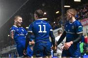 1 January 2024; Rob Russell of Leinster celebrates with Sam Prendergast, left, and Tommy O'Brien after scoring their side's second try during the United Rugby Championship match between Leinster and Ulster at RDS Arena in Dublin. Photo by Ramsey Cardy/Sportsfile