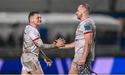 1 January 2024; Mike Lowry, left, and Luke Marshall of Ulster celebrate after the United Rugby Championship match between Leinster and Ulster at RDS Arena in Dublin. Photo by Ramsey Cardy/Sportsfile