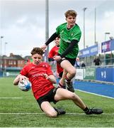3 January 2024; Hugh Michael O'Dwyer of North East scores his side's first try despite the attempts of Zak Hernan of South East Area during the BearingPoint Shane Horgan Cup Round 3 match between South East and North East at Energia Park in Dublin. Photo by Ben McShane/Sportsfile