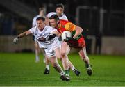 3 January 2024; John Murphy of Carlow in action against Niall Kelly of Kildare during the Dioralyte O'Byrne Cup Round 1 match between Carlow and Kildare at Netwatch Cullen Park in Carlow. Photo by Matt Browne/Sportsfile