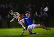 3 January 2024; Jack Bryant of Offaly in action against Seamus Lacey of Laois during the Dioralyte O'Byrne Cup Round 1 match between Laois and Offaly at Stradbally GAA Grounds in Stradbally, Laois. Photo by Harry Murphy/Sportsfile