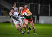 3 January 2024; John Murphy of Carlow in action against Niall Kelly of Kildare during the Dioralyte O'Byrne Cup Round 1 match between Carlow and Kildare at Netwatch Cullen Park in Carlow. Photo by Matt Browne/Sportsfile