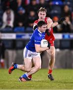 3 January 2024; Niall Carolan of Cavan in action against Donncha Gilmore of Derry during the Bank of Ireland Dr McKenna Cup Group B match between Cavan and Derry at Kingspan Breffni in Cavan. Photo by Piaras Ó Mídheach/Sportsfile
