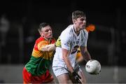 3 January 2024; Luke Killian of Kildare in action against Mikey Bambrick of Carlow during the Dioralyte O'Byrne Cup Round 1 match between Carlow and Kildare at Netwatch Cullen Park in Carlow. Photo by Matt Browne/Sportsfile