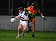3 January 2024; Luke Killian of Kildare in action against John Phiri of Carlow during the Dioralyte O'Byrne Cup Round 1 match between Carlow and Kildare at Netwatch Cullen Park in Carlow. Photo by Matt Browne/Sportsfile