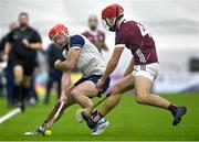 4 January 2024; Ruadhan Mulrooney of New York in action against Fergus Hanney of Galway during the Connacht Hurling League semi-final match between Galway and New York at University of Galway Connacht GAA AirDome in Bekan, Mayo. Photo by Tyler Miller/Sportsfile