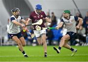 4 January 2024; Seanie Joyce of Galway in action against Darragh Hynes of New York, left, and Aidan Organ during the Connacht Hurling League semi-final match between Galway and New York at University of Galway Connacht GAA AirDome in Bekan, Mayo. Photo by Tyler Miller/Sportsfile