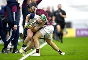 4 January 2024; Aidan Organ of New York is tackled by MacDara Ó'Bearra of Galway during the Connacht Hurling League semi-final match between Galway and New York at University of Galway Connacht GAA AirDome in Bekan, Mayo. Photo by Tyler Miller/Sportsfile