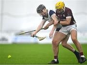 4 January 2024; Evan Deegan of New York in action against Micheál Lyons of Galway during the Connacht Hurling League semi-final match between Galway and New York at University of Galway Connacht GAA AirDome in Bekan, Mayo. Photo by Tyler Miller/Sportsfile