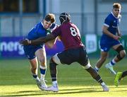 5 January 2024; Charlie Tector of Leinster is tackled by Sean Edogbo of Ireland during the Challenge Match between Ireland U20s and Leinster Development at Energia Park in Dublin. Photo by Harry Murphy/Sportsfile