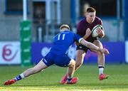 5 January 2024; Ben O'Connor of Ireland is tackled by Andrew Osborne of Leinster during the Challenge Match between Ireland U20s and Leinster Development at Energia Park in Dublin. Photo by Harry Murphy/Sportsfile