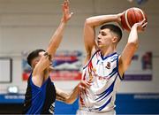 5 January 2024; Conor O'Sullivan of Neptune in action against James Hannigan of UCC Demons during the Basketball Ireland Pat Duffy National Cup semi-final match between Energywise Ireland Neptune and UCC Demons at Neptune Stadium in Cork.  Photo by Eóin Noonan/Sportsfile