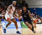 5 January 2024; Seventh Woods of UCC Demons in action against Derek Murphy of Neptune during the Basketball Ireland Pat Duffy National Cup semi-final match between Energywise Ireland Neptune and UCC Demons at Neptune Stadium in Cork.  Photo by Eóin Noonan/Sportsfile