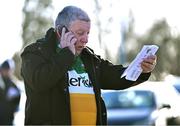 6 January 2024; Offaly supporter Mick McDonagh, from Tullamore, relays the Dublin team news to a friend on the phone from the car park before the Dioralyte O'Byrne Cup quarter-final match between Offaly and Dublin at Gracefield GAA club in Kilmalogue, Offaly. Photo by Piaras Ó Mídheach/Sportsfile